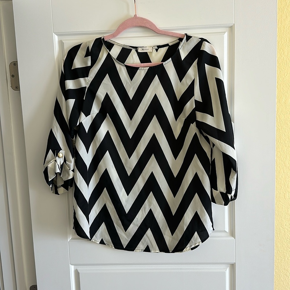 Black and ivory Chevron patterned blouse.